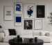 Parede com quadros decorativos minimalistas com arte abstrata em tons neutros e azul, representando equilíbrio entre caos e minimalismo